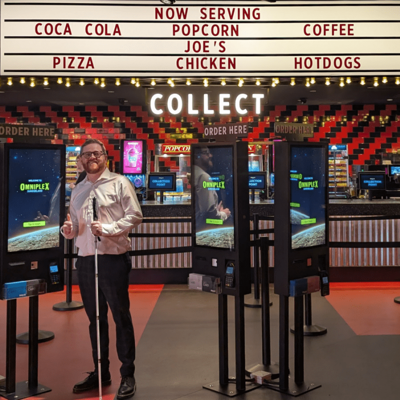 Joe Davison, the developer behind the Omniplex ATM seeing it in action